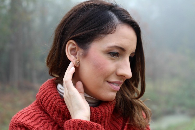 Kendra Scott earrings, and a cowl neck sweater
