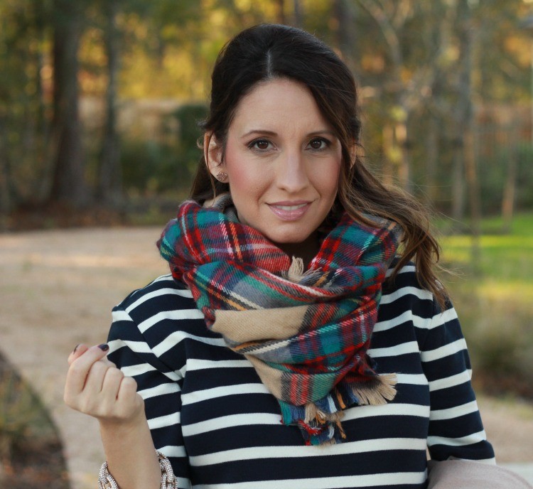 Kendra Scott earrings, plaid scarf, and pulled back hair