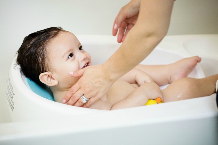 Bath time in baby Manny's 4 Moms Tub