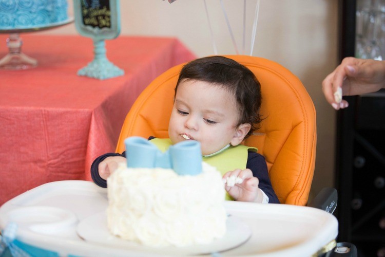 Manny Jr. tasting cake for the first time