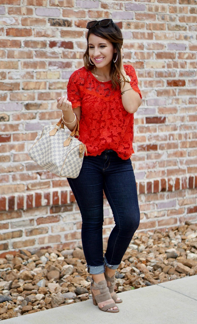 Red lace top, skinny jeans, and louis vuitton bag