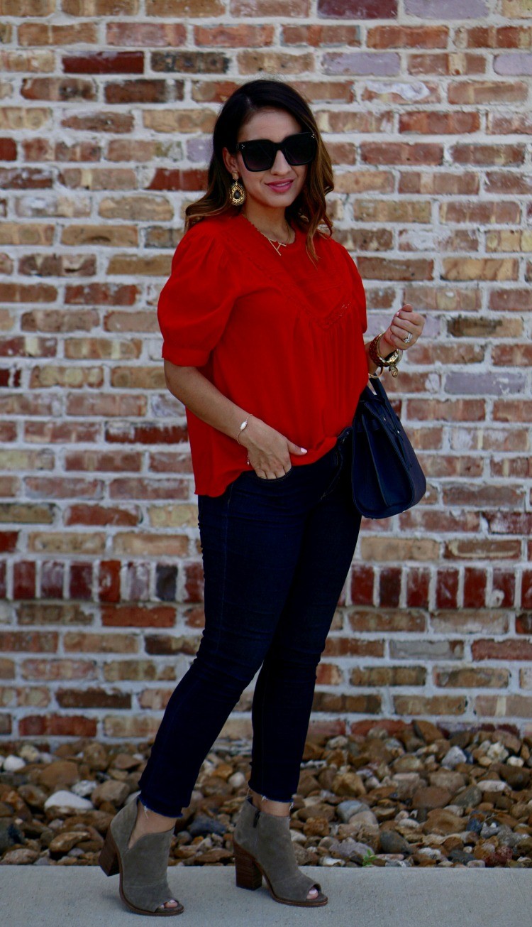 Red top, skinny jeans, and booties