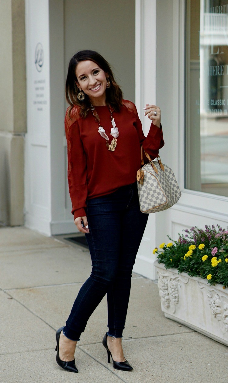 Lace inset blouse, dark skinny jeans, heels, and Louis Vuitton Speedy
