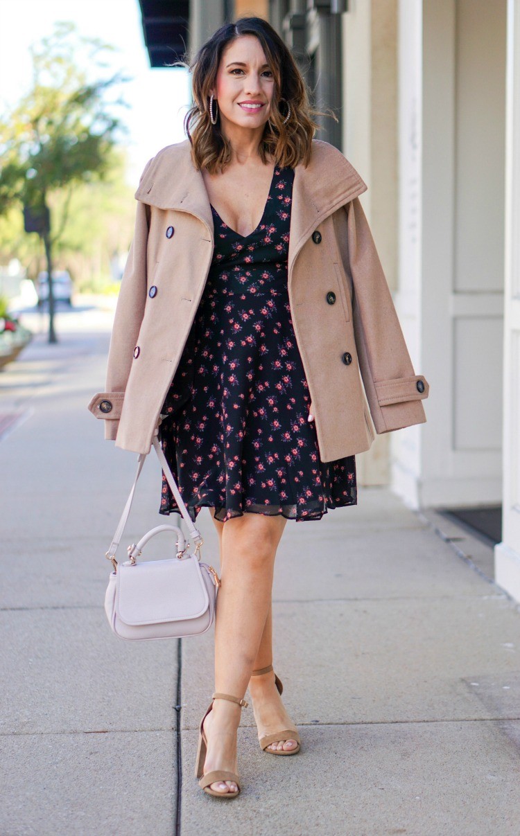 Pearl statement earrings, camel coat, floral dress, nude heels, and pink handbag