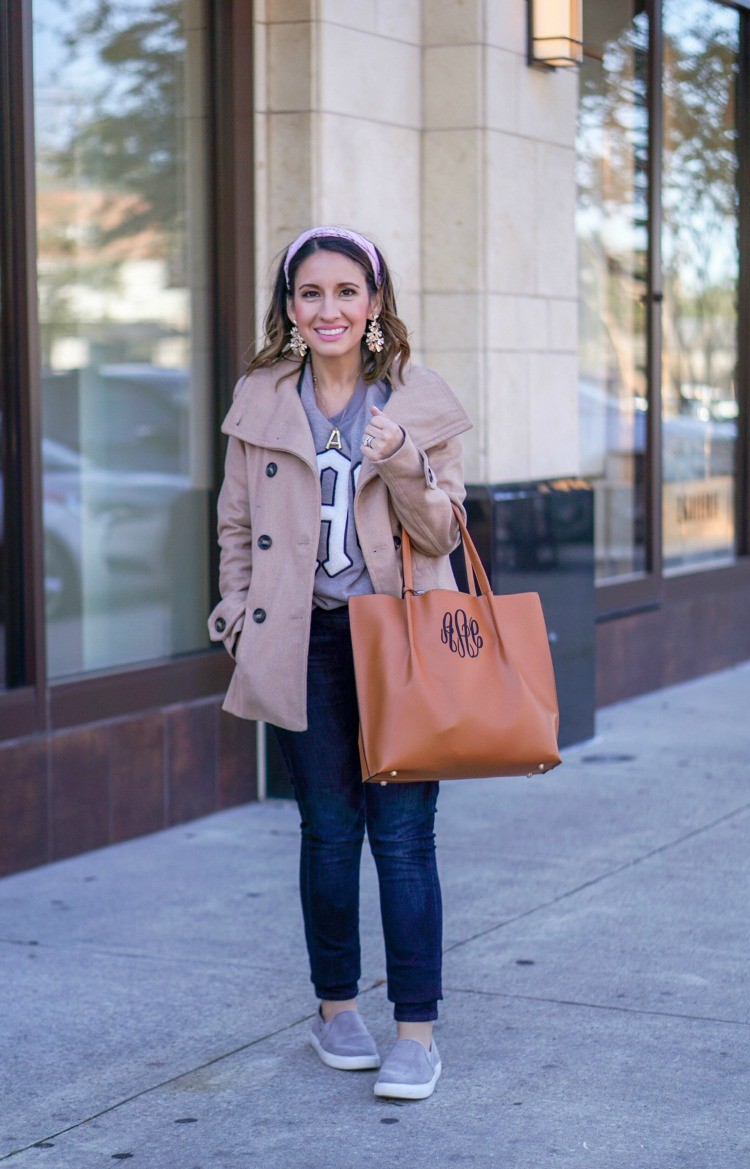 Monogrammed sweatshirt, dark skinnies, and brown handbag