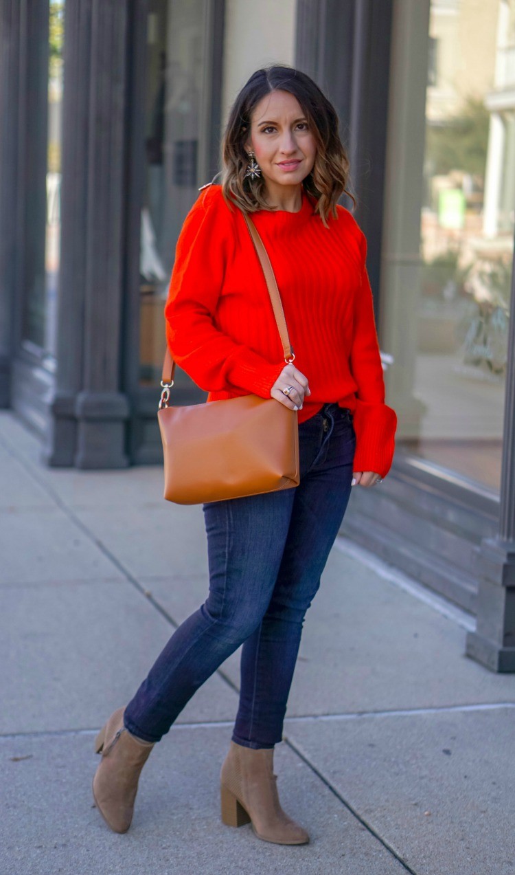 Red sweater, dark jeans and booties